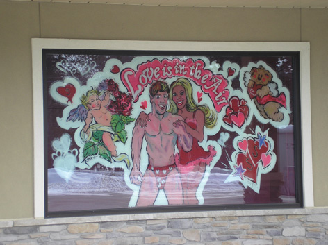 Valentine's Day window art work for love shop.