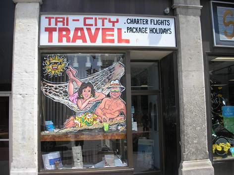 Promotional window art work for Tri-City Travel.