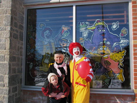 Dorothy with Ronald MacDonald in front of her window art!