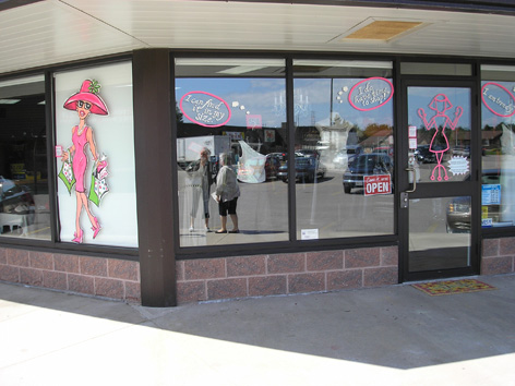 Promotional window art work for Smitten clothing store.