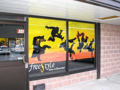 Promotional window artwork for Free Style dance class.