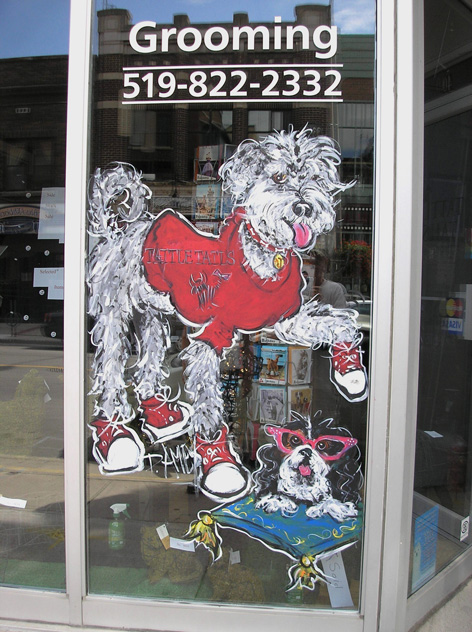 Promotional window art work for pet store.